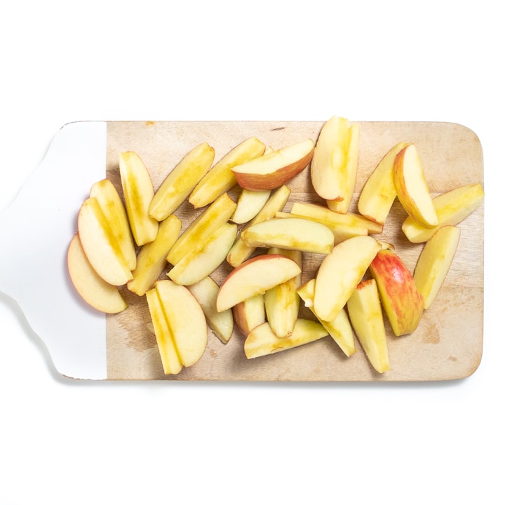 cutting board with apple chunks