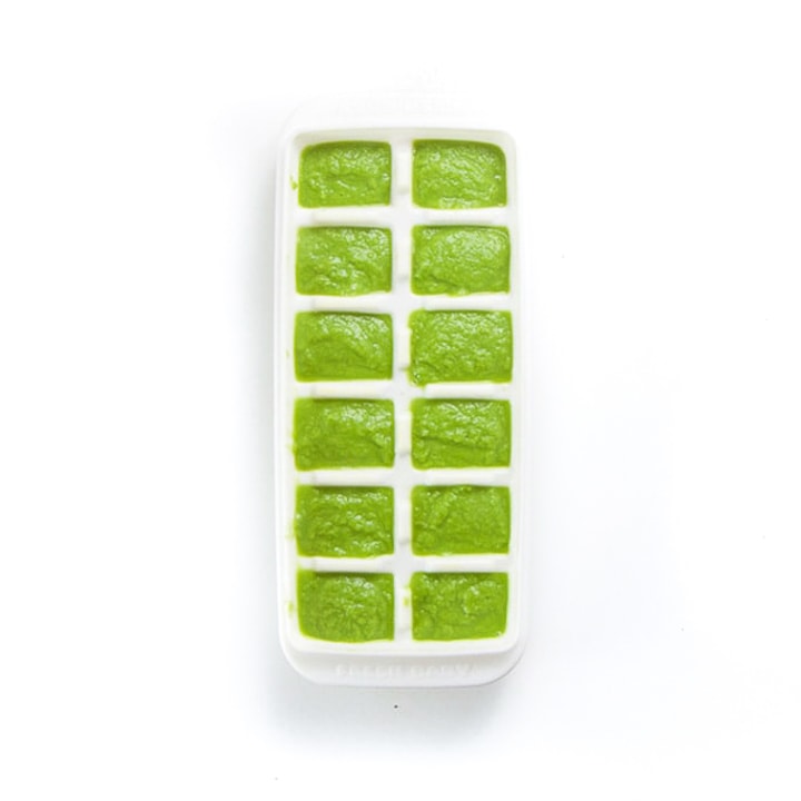 White freezer tray filled with green bean puree.