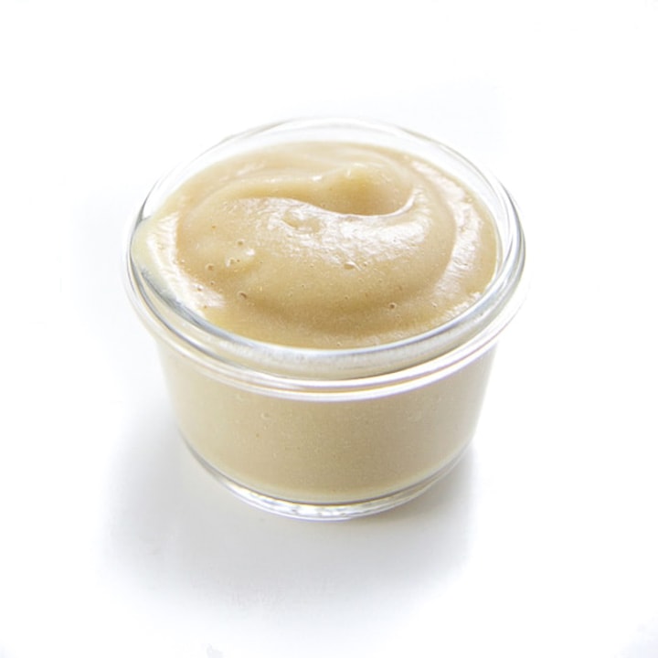 Jar of pear puree for baby.