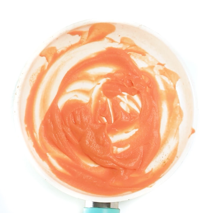 Saucepan filled with thawed baby food puree.