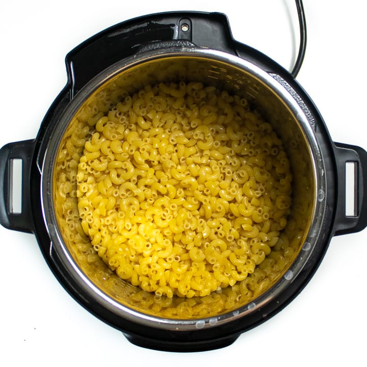 Instant pot with cooked noodles.
