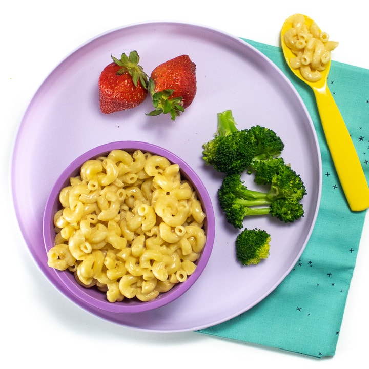 Purple kids dinner plate with an easy instant pot Mac and cheese with healthy sides.