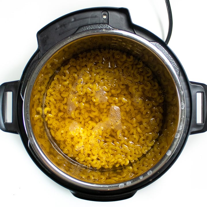 Instant pot with water and noodles.